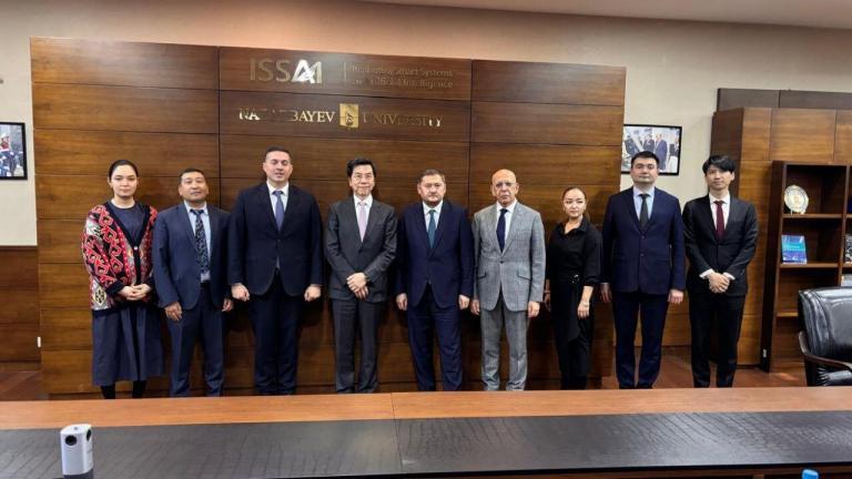 Dr. Lee was welcomed by NU President Dr.